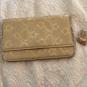 Gold snake print clutch